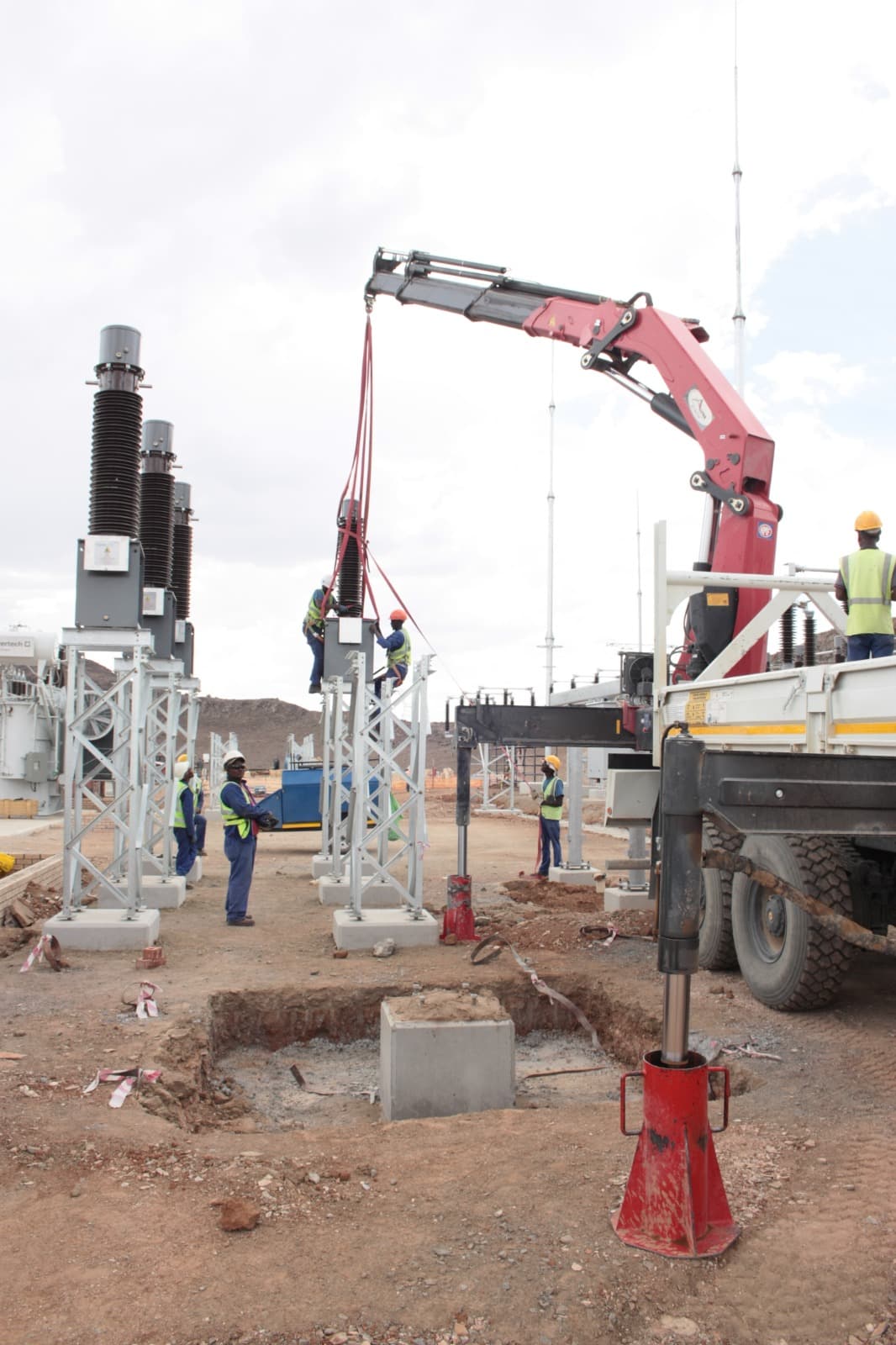ELTEK team installing substation equipment with a crane