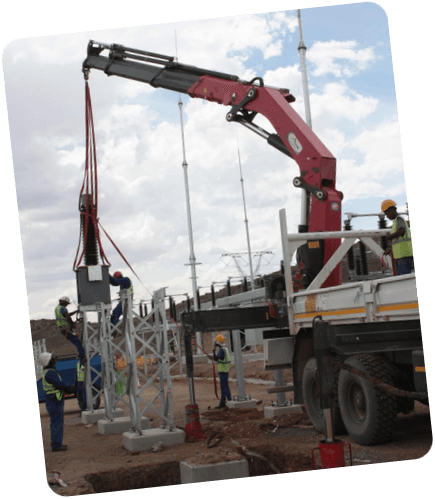 ELTEK crane lifting electrical equipment at a substation construction site